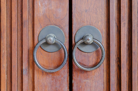 Wooden door and metal door knocker chinese style architecture.の写真素材
