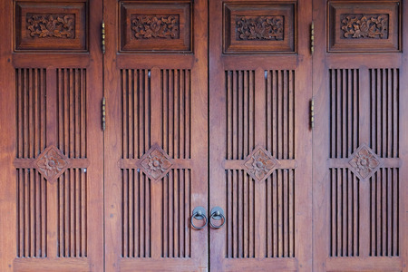 Wooden door and metal door knocker chinese style architecture.の写真素材