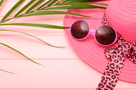 Summer concept; Idea with pink collection summer hat and sunglasses on pink wooden.のeditorial素材