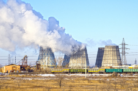 Territory of heat and power station. Accumulator tanks and cooling towers. Winter. Russiaの写真素材