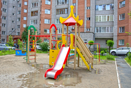 Children's playground after rain. provincial town. summer. Russia