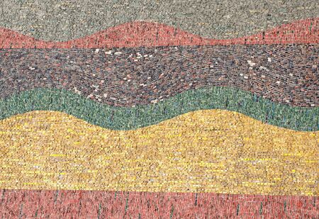 Mosaic of small pieces of glass on the facade of the building