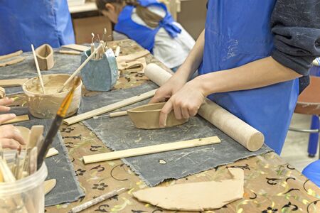 Passion and hobbies. Children are engaged in needlework, clay modeling