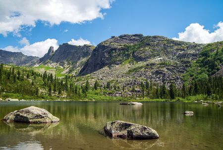 Ergaki Park. Rainbow Lake. Hanging stone and sleeping Sayanの写真素材