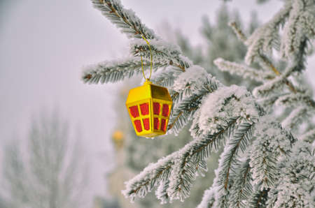 Christmas and New Year tree in the park on the background of the church