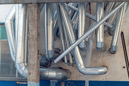 huge, industrial pipes in a factoryの写真素材