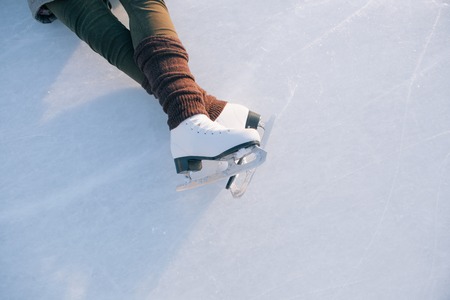 Tilted blue version, ice skates with reflection.の写真素材