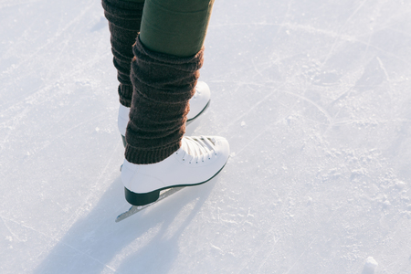 Tilted blue version, ice skates with reflection.の写真素材