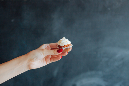 Birthday Cupcake with a sparkler over a blue background.の写真素材
