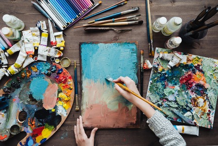 Painting tools: gouache, watercolor, crayons set, palette and paintbrush collection arranged, prepared for drawing in art studio.の写真素材