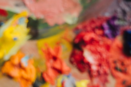 Colorful background made oil paints on a wooden backgroundの写真素材