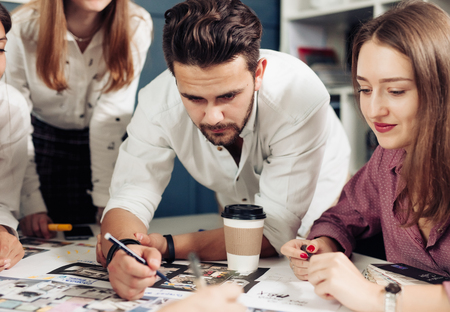 Team of architects working on construction plansの写真素材