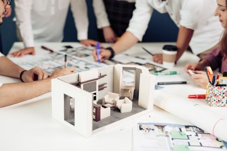 Confident team of engineers working together in a architect studio.の写真素材