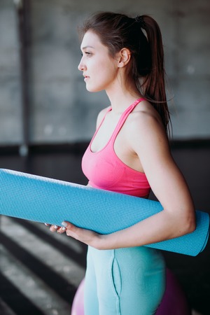 Woman with skipping rope in the gymの写真素材