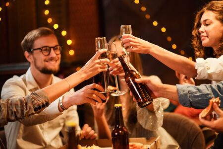 Happy group of friends at the bar having drinks.の写真素材