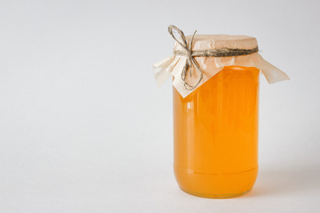 Nuts and honey photoset. Honey in a jar. Isolated on a white background.の写真素材