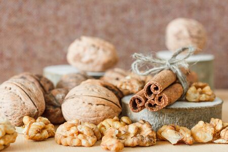 Nuts and honey photoset. Honey, walnut, cinnamon, sawed wood.の写真素材