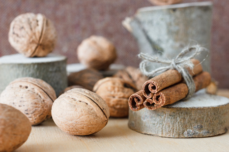 Nuts and honey photoset. Honey, walnut, cinnamon, sawed wood.の写真素材