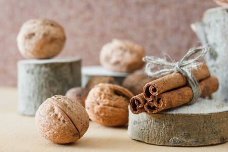 Nuts and honey photoset. Honey, walnut, cinnamon, sawed wood.の写真素材
