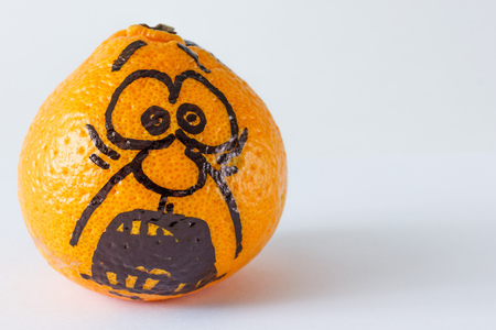 Emotion faces on mandarins photoset. Fearful face.の写真素材