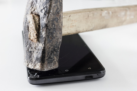Mobile phone photoset. Breaking mobile phone with hammer.の写真素材