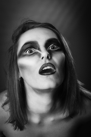 Raven woman photoset. Woman with raven make up portrait.の写真素材