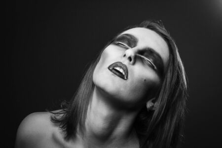 Raven woman photoset. Woman with raven make up portrait.の写真素材