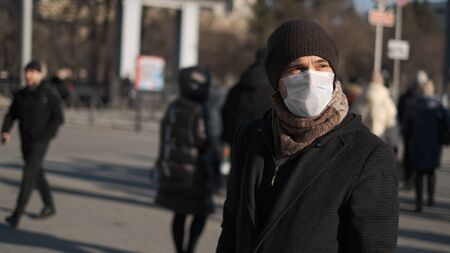 Europe infected corona virus 2019 ncov. European man 4k. Face mask for covid-19. City street....