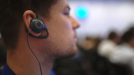 Audience business meeting crowded forum person. Viewer seminar listen earphone speaker auditorium....