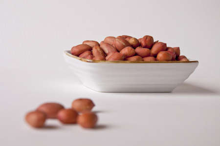 Healthy tasty peanuts in Small dishの写真素材