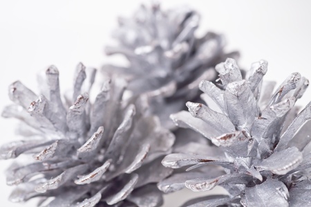 three silver pinecone closeup