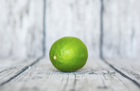 green lemon put on wooden tableの写真素材