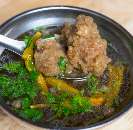 Pork ball with sweet pepper and parsley in a bowl.の写真素材