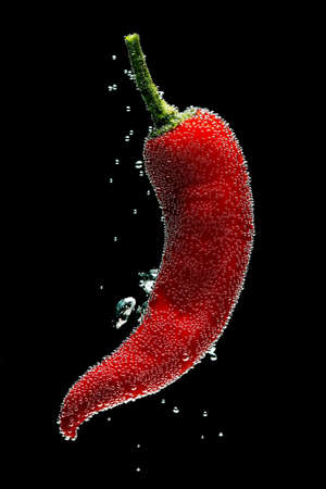 Red Peppers  Splashing In Water, bubbleの写真素材