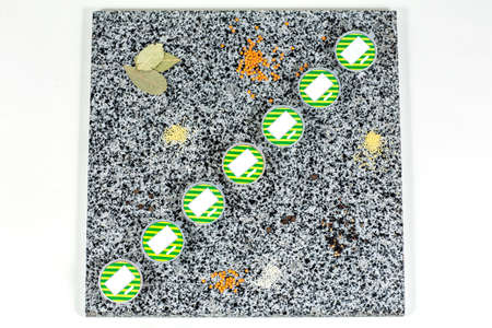 Dried spices in plastic containers on a marble background, top view. Close-upの写真素材