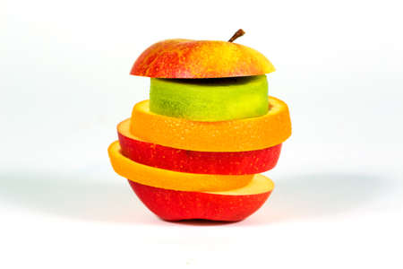 Pieces fresh fruit apple, orange, kiwi on white background. Close-upの写真素材