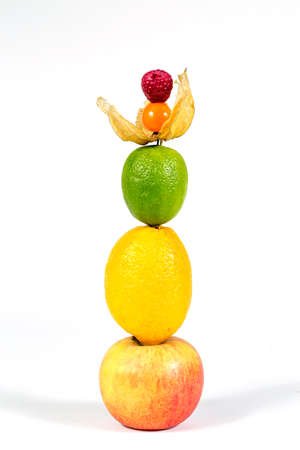 Fresh apple, lemon, lime, physalis and raspberries  on white background. Close-upの写真素材