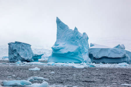 Beautifull big blue iceberg and ocean. Peculiar landscape of the Antarctica landscape