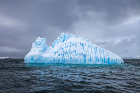 Beautifull big blue iceberg and ocean. Peculiar landscape of the Antarctica landscapeの写真素材