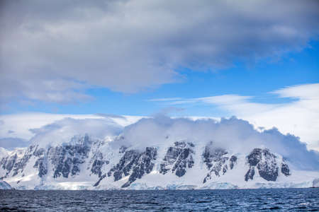 Landscapes Antarctica beautiful snow-capped mountains against the blue sky.の写真素材