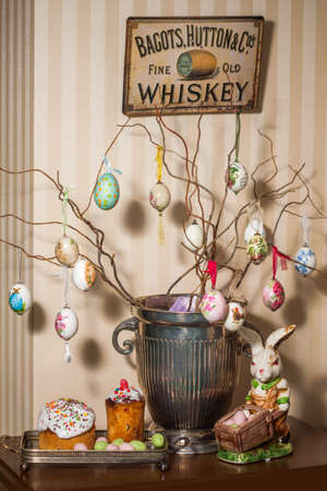 Decorative Easter eggs near the easter cake and bunny. Close-up