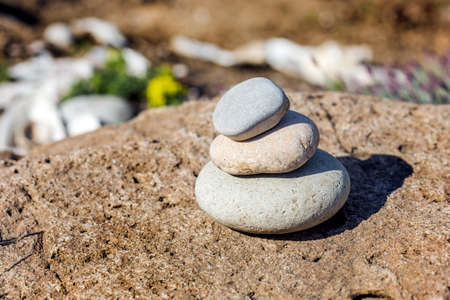 Spa stones on garden backgroundの写真素材