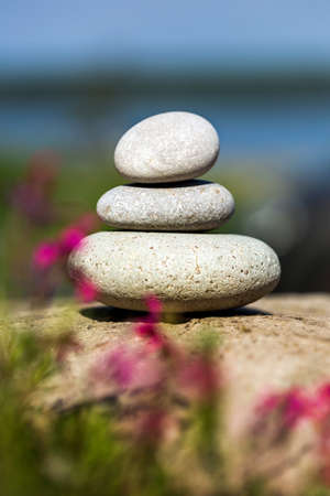 Spa stones on garden backgroundの写真素材