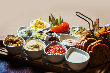 delicious sauces in assortment. bread potatoes