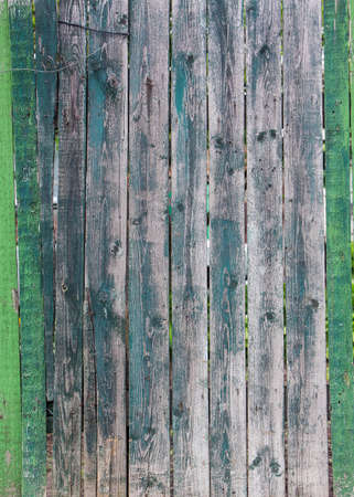 old green and grey wooden fence background.の写真素材
