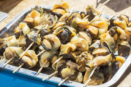 Rapana shellfish on skewers