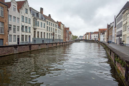 BRUGGE, BELGIUM - JULY 4, 2017 : cityscape with water canal and bridgeのeditorial素材