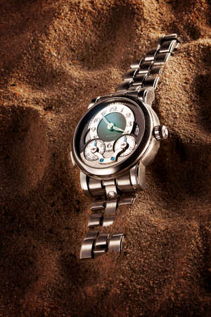 watch in the sand.の写真素材
