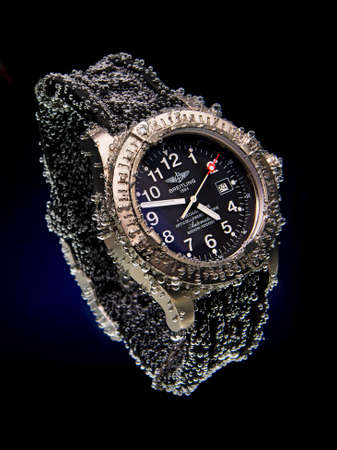 Drops of water falling on watchのeditorial素材