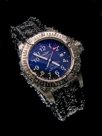 Drops of water falling on watchのeditorial素材